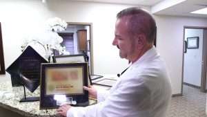 Dr. Eric Ashby shows an example of a certificate you can order online.