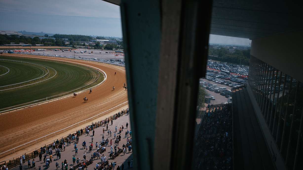 Jockeys ride their horses after a race at Aqueduct Racetrack on closing day in the Queens borough of New York, Sunday, June 28, 2026.
