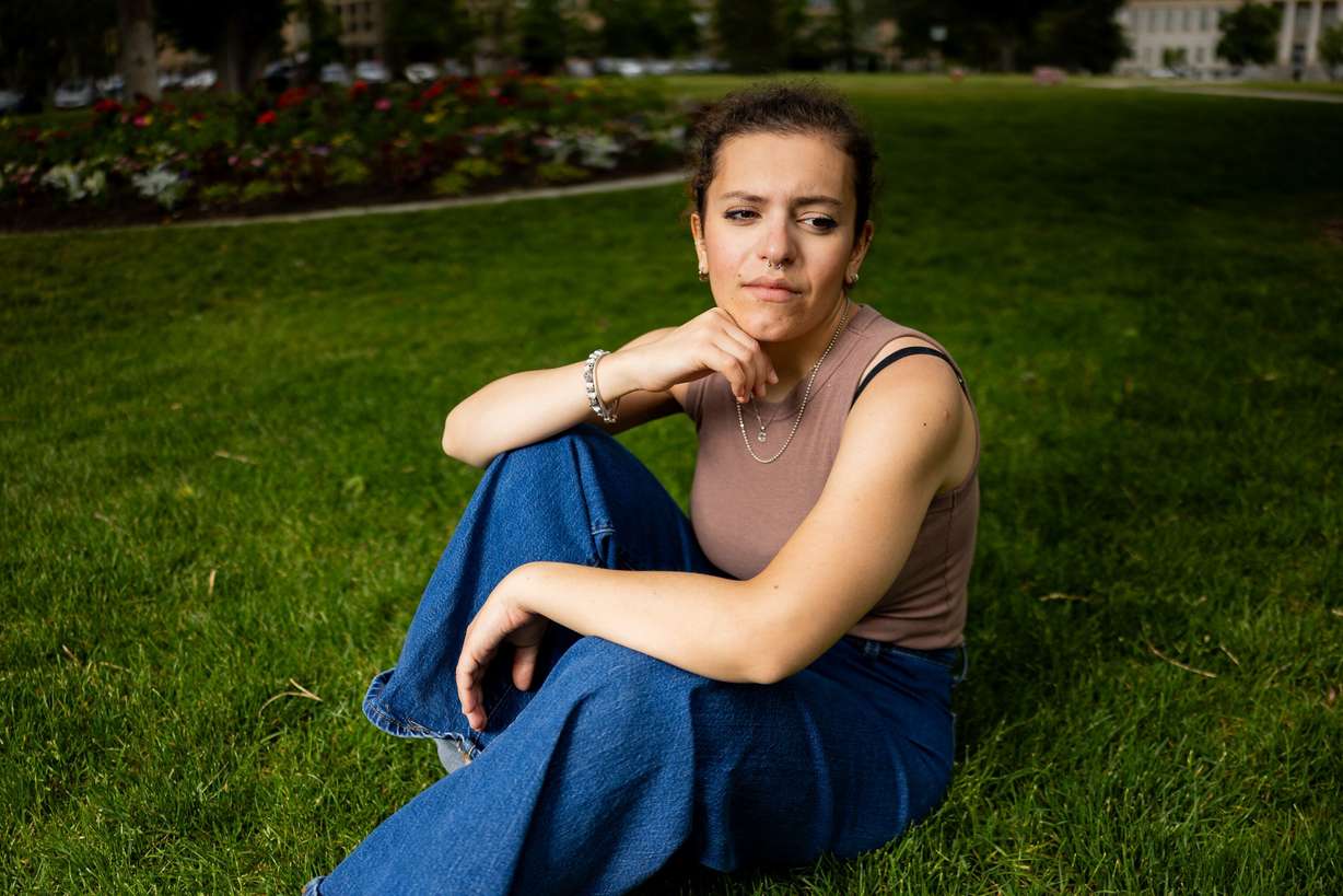 Giulia Tesoriere poses on campus at the University of Utah at Presidents' Circle in Salt Lake City on May 29. Tesoriere, an employee at Huntsman Cancer Institute, caught a recent housing scam before it happened and shared the information with University of Utah students.