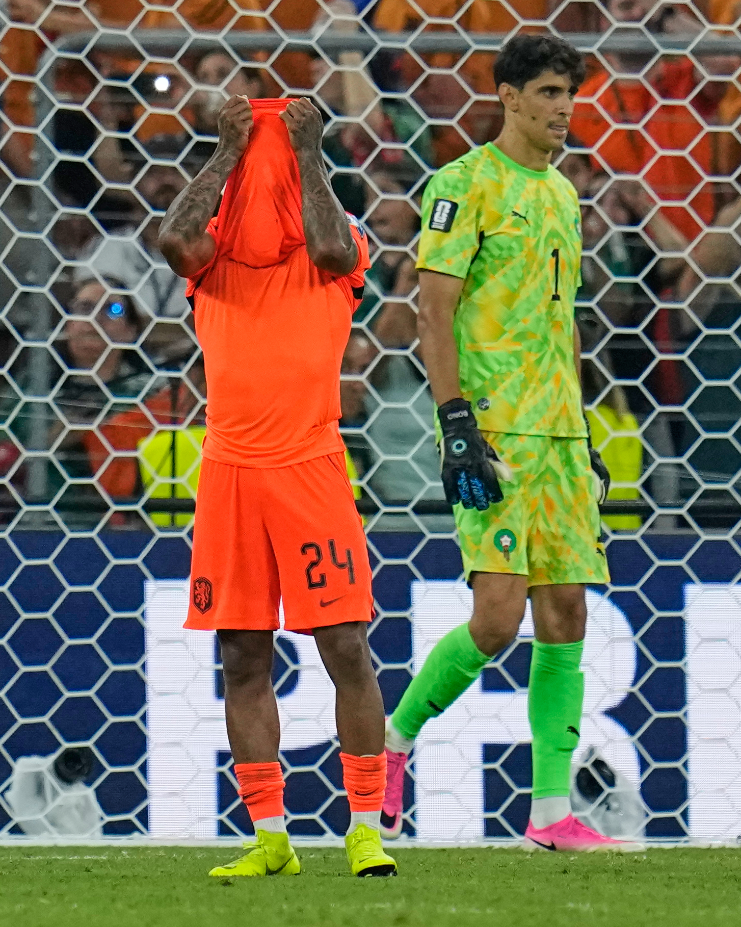 Netherlands' Crysencio Summerville (24) reacts after missing a penalty as Morocco goalkeeper Yassine Bounou (1) walks past during the World Cup round of 32 soccer match between the Netherlands and Morocco in Guadalupe, near Monterrey, Mexico, Monday, June 29, 2026. 