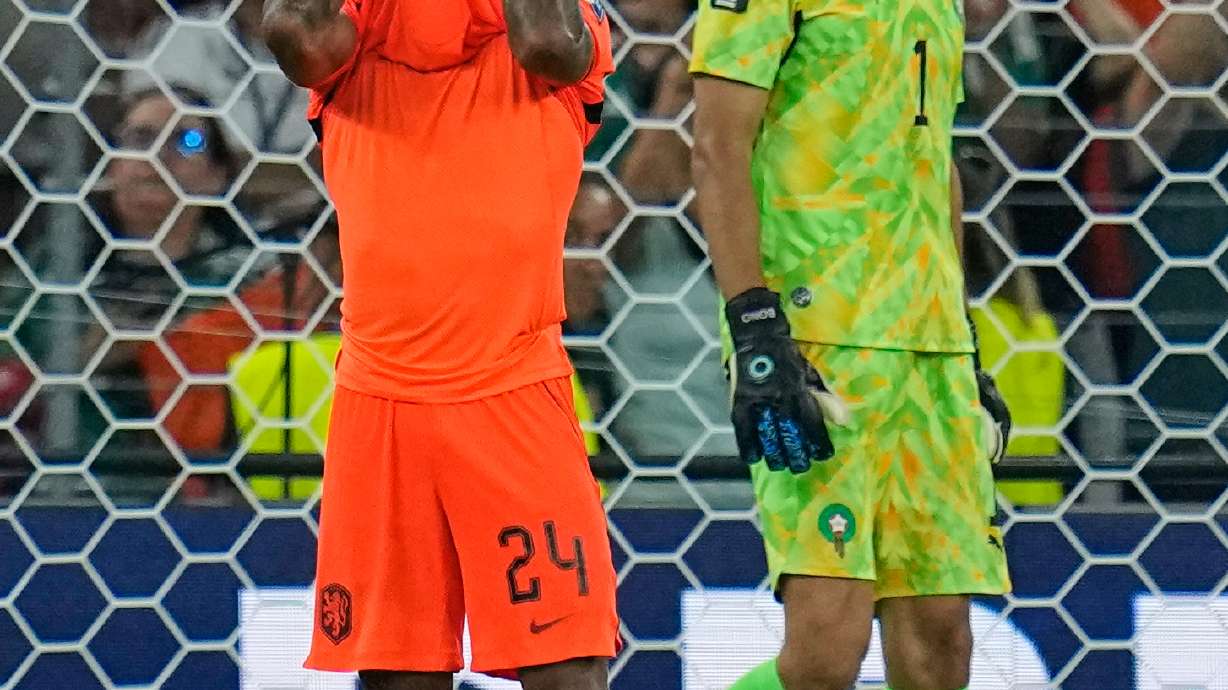 Netherlands' Crysencio Summerville (24) reacts after missing a penalty as Morocco goalkeeper Yassine Bounou (1) walks past during the World Cup round of 32 soccer match between the Netherlands and Morocco in Guadalupe, near Monterrey, Mexico, Monday, June 29, 2026.