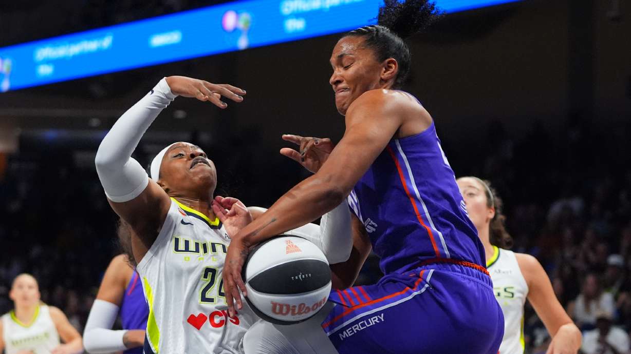 Phoenix Mercury forward Alyssa Thomas (25) strips the ball from Dallas Wings guard Arike Ogunbowale (24) during the first half of a WNBA basketball game in Arlington, Texas, Thursday, June 11, 2026.