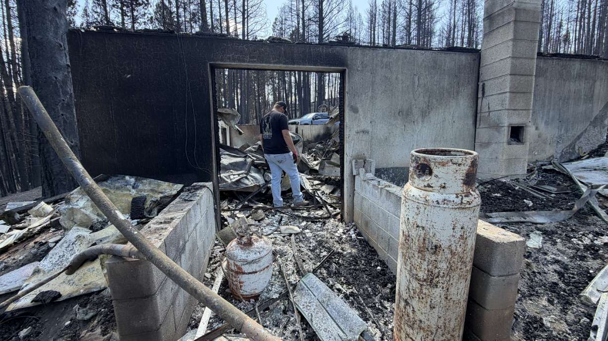 A cabin is pictured on Tuesday after it was destroyed in the Cottonwood Fire.