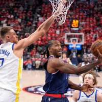 Center Kristaps Porzingis re-signing with Warriors on two-year, $40 million deal