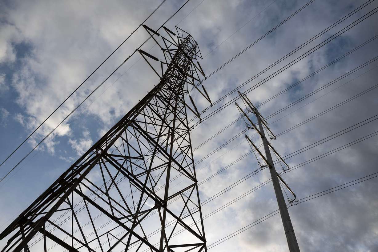 Power lines and transmission lines in the West Jordan area of the Salt Lake Valley on Monday, Dec. 22, 2025.
