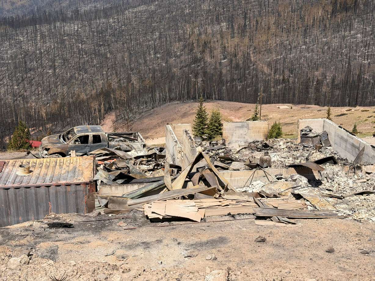 Charred remains of houses and vehicles in Eagle Point Resort’s West Village outside of Beaver, Tuesday, after the Cottonwood Fire torched much of the area. Matt Clarke is one of the residents who lost property in the fire.