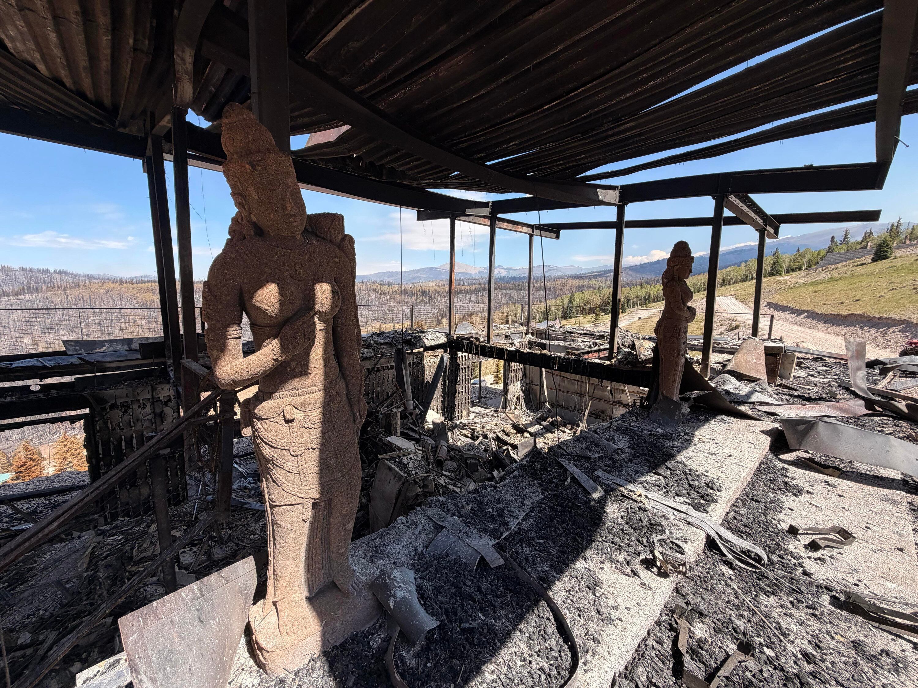 Charred remains of houses and vehicles in Eagle Point Resort’s West Village outside of Beaver, Tuesday, after the Cottonwood Fire torched much of the area. Federal permitting is slowing down fire mitigation efforts, an expert said.