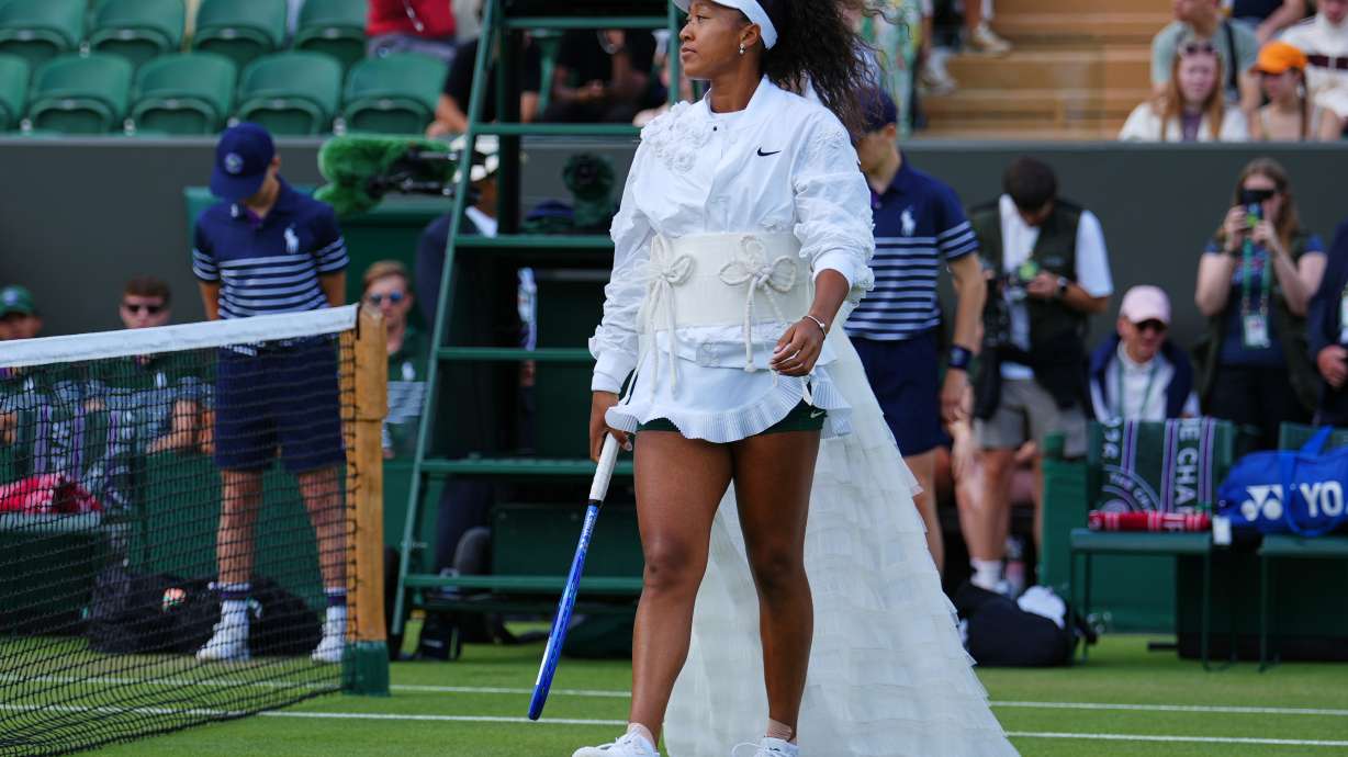 Naomi Osaka of Japan enters the court for the second round women's singles match against Anastasia Gasanova of Russia at the Wimbledon Tennis Championships in London, Wednesday, July 1, 2026.
