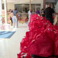 AARP volunteers team up with Utah Food Bank to feed students