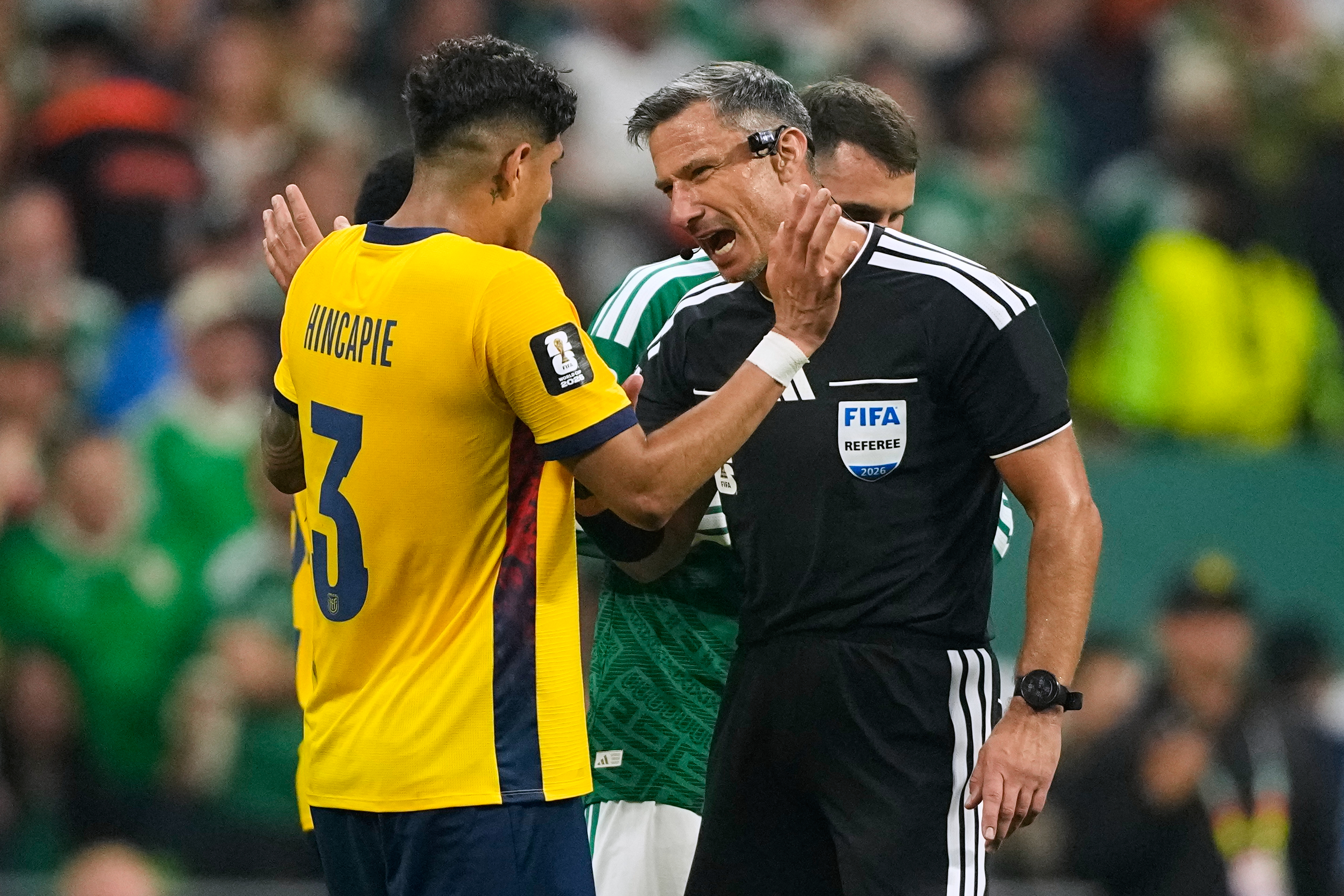Referee Slavko Vincic of Slovenia speaks to Ecuador's Piero Hincapie (3) before sending him from the field during the World Cup round of 32 soccer match between Mexico and Ecuador in Mexico City, Tuesday, June 30, 2026. 