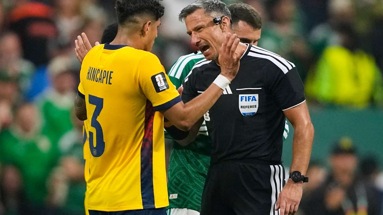 Referee Slavko Vincic of Slovenia speaks to Ecuador's Piero Hincapie (3) before sending him from the field during the World Cup round of 32 soccer match between Mexico and Ecuador in Mexico City, Tuesday, June 30, 2026.