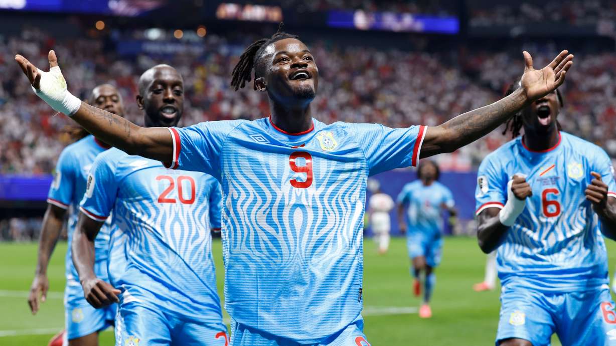 Congo's Brian Cipenga (9) celebrates with teammates after scoring their first goal during the World Cup round of 32 soccer match between England and Congo in Atlanta, Wednesday, July 1, 2026.