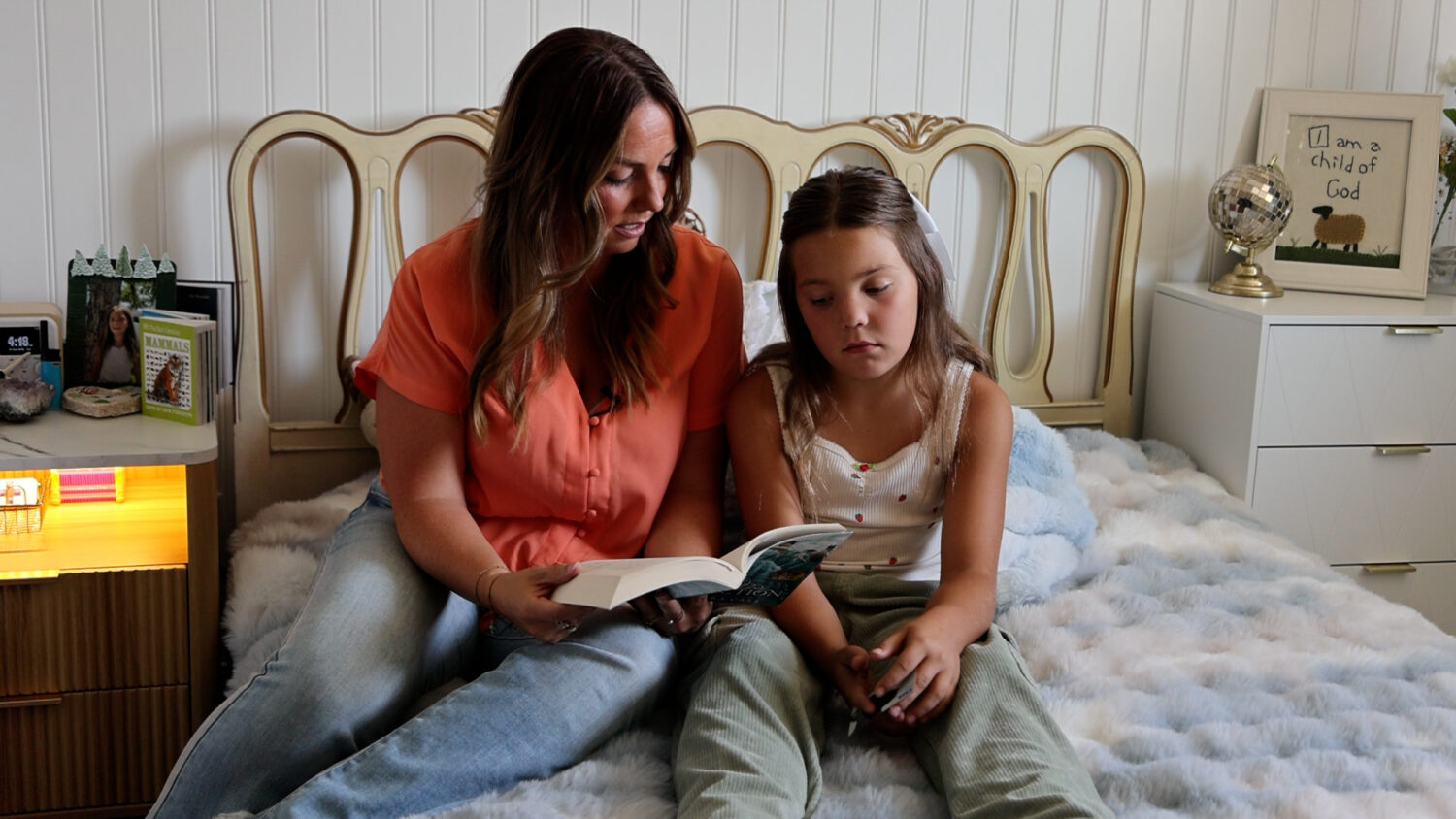 Mary Millward, mom of six, reads to her daughter on Aug. 14, 2025.