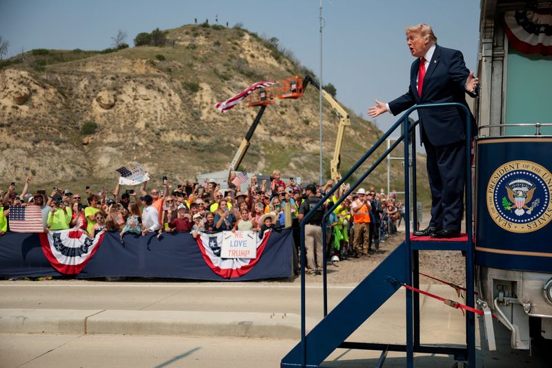 President Donald Trump steps off a ceremonial train after arriving for the dedication of the Theodore Roosevelt Presidential Library in Medora, North Dakota, Wednesday.