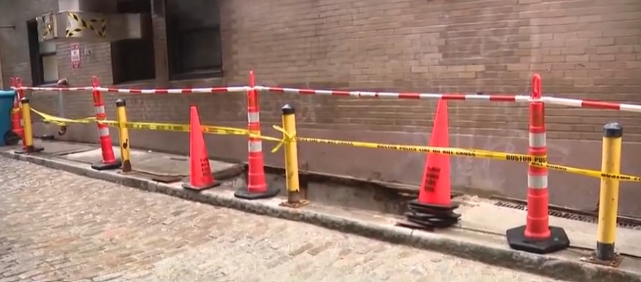 Worker falls down old coal chute outside hotel in Boston