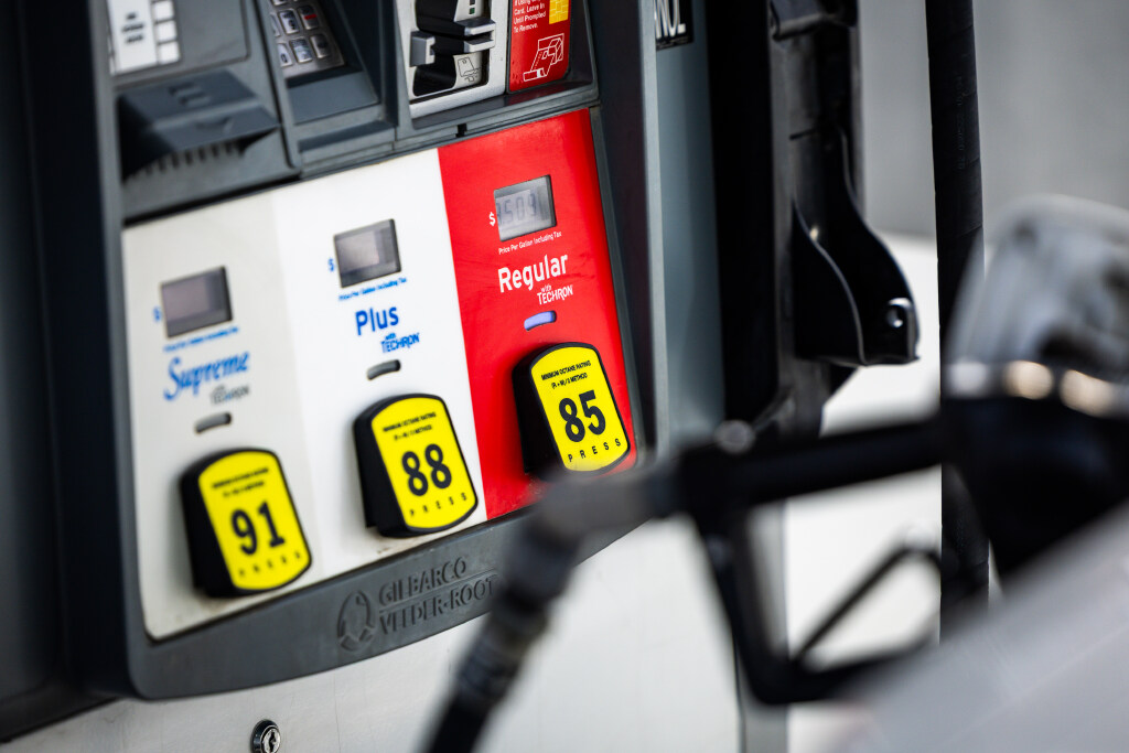 Gas prices are displayed as a gas pump refuels a car at a Holiday Chevron gas station in Herriman on Thursday, March 12, 2026.