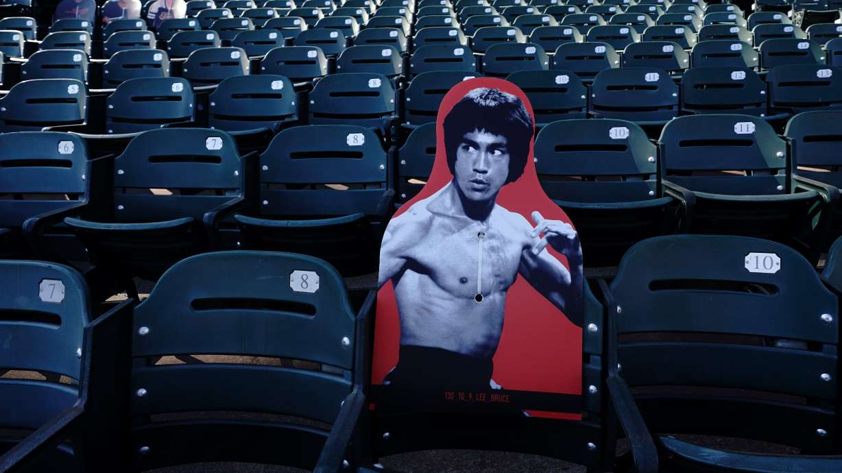 A cardboard cutout of martial artist Bruce Lee is displayed at Oracle Park before a baseball game between the San Francisco Giants and the San Diego Padres in San Francisco, July 30, 2020.