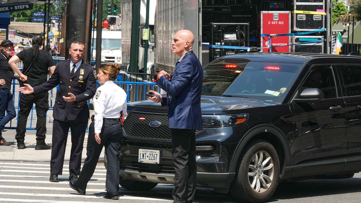 Security personnel meet outside New York's Madison Square Garden, Wednesday, July 1, 2026.