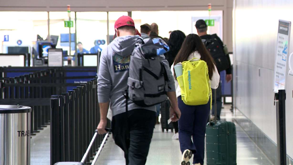Travelers depart the Salt Lake City International Airport on Nov. 25, 2025, during the Thanksgiving travel rush.