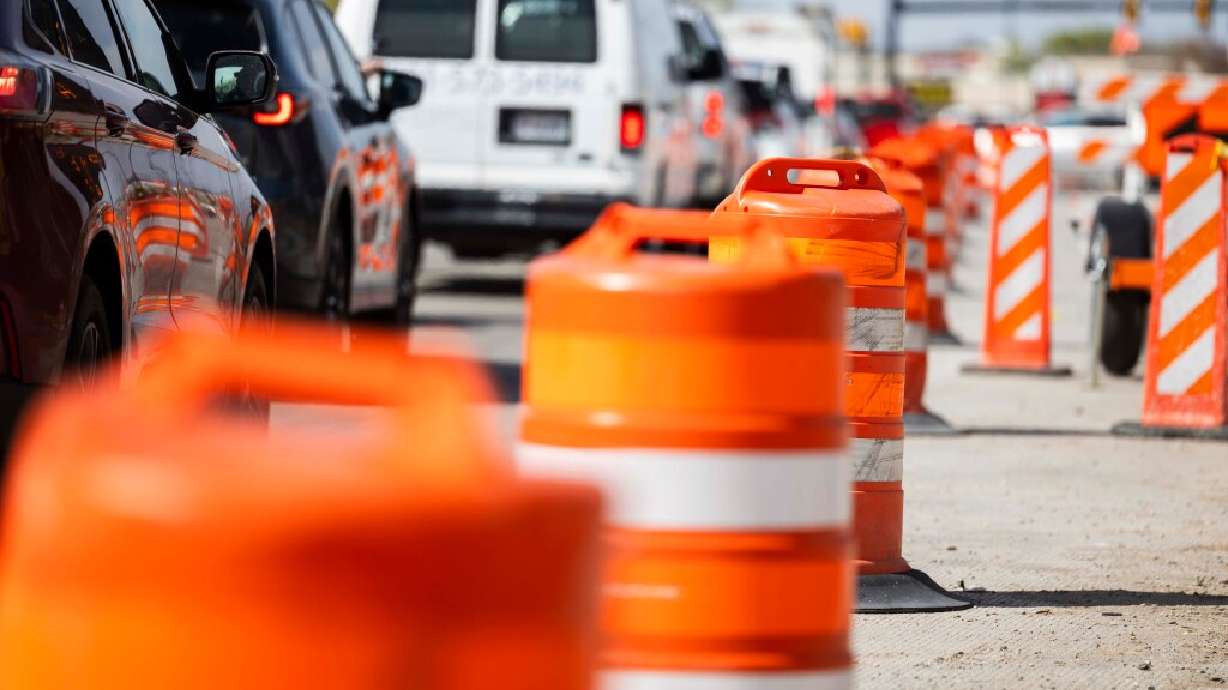 Cars pass through a construction zone connected to a project to widen 1800 North in Sunset on Tuesday, April 15, 2025. (Brice Tucker, Deseret News)