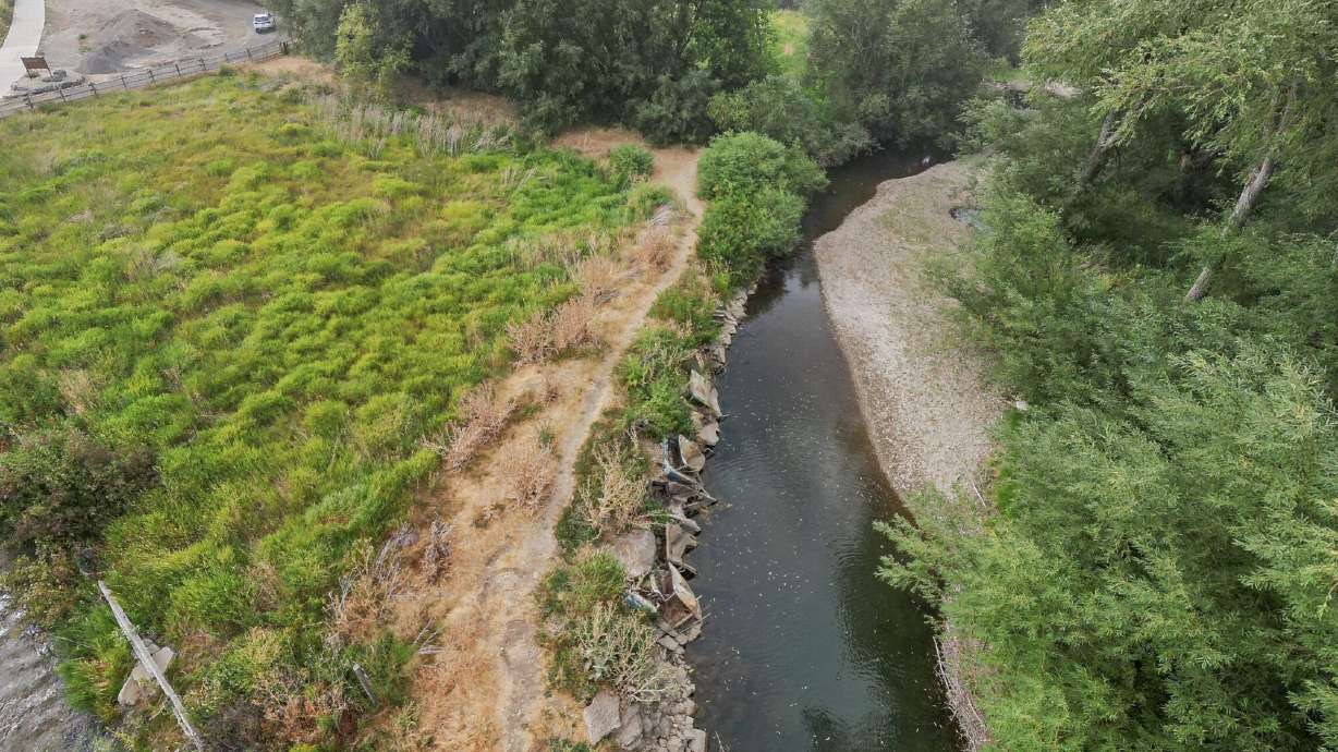 Dozens of old cars, debris pulled from Logan river in restoration project
