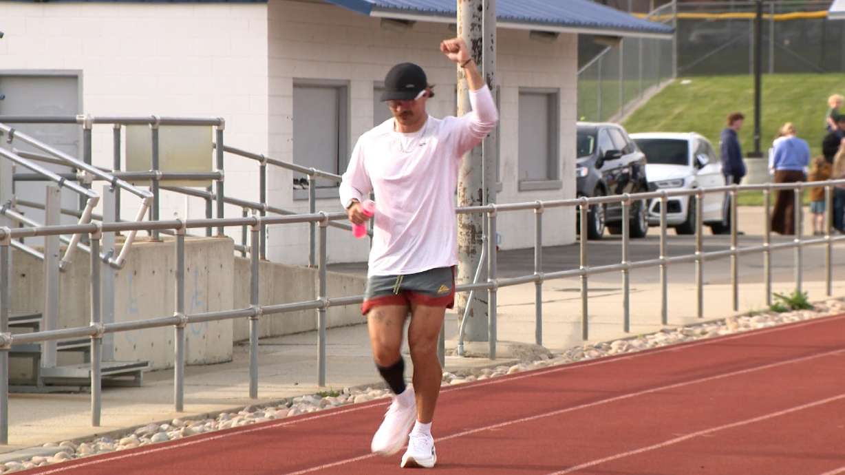 Ultra runner half-way to 1,000 miles around Layton High's track; running to support The Single Parent Project