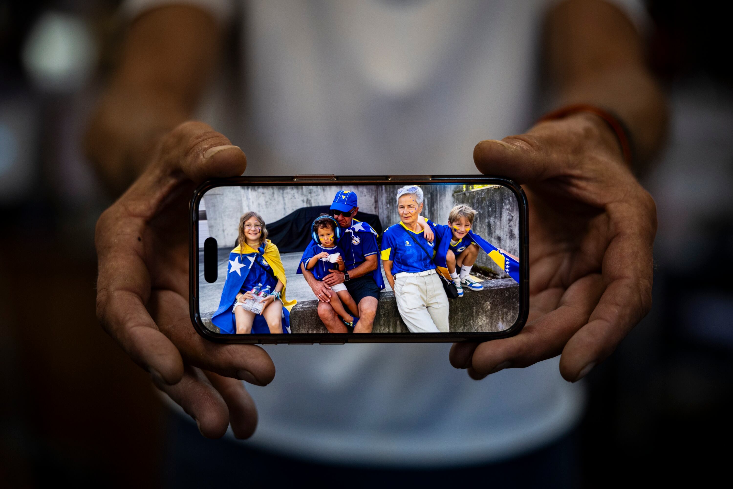 A photo taken by Ibro Sameric, owner of Old Bridge Cafe, shows himself with his wife, Mila Sameric, and children Esma Hindić, 11, Idris Chardi, 3, and Edvin Hindić, 9, around the time of the Bosnia and Herzegovina vs. Qatar FIFA World Cup match held on June 24 in Seattle, Wash., at his restaurant in South Salt Lake on Wednesday.