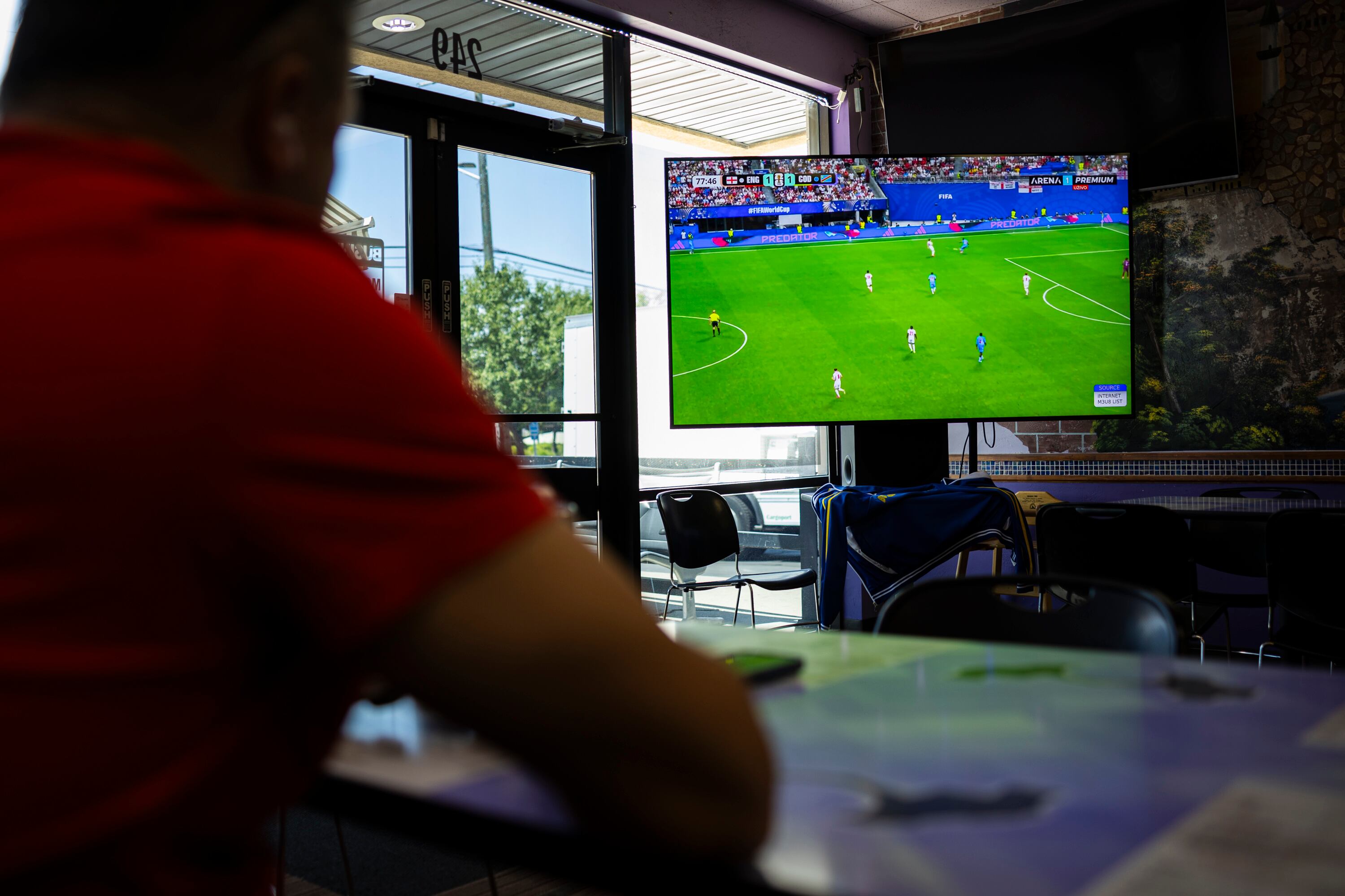 A customer watches a FIFA World Cup game at Old Bridge Cafe in South Salt Lake on Wednesday.
