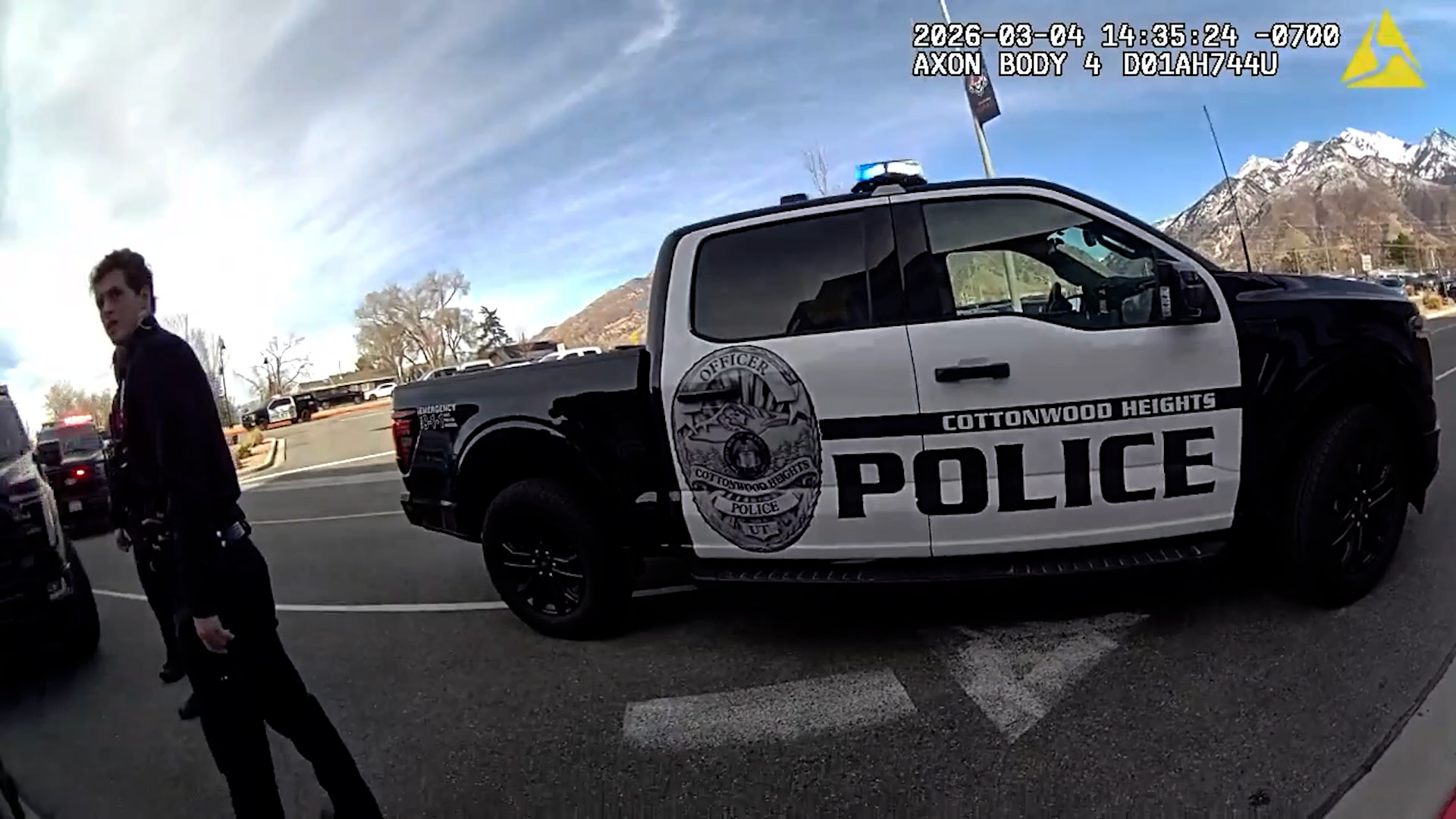 A body camera freeze frame from Cottonwood Heights police shows the response to a weapons-related incident at Brighton High School.