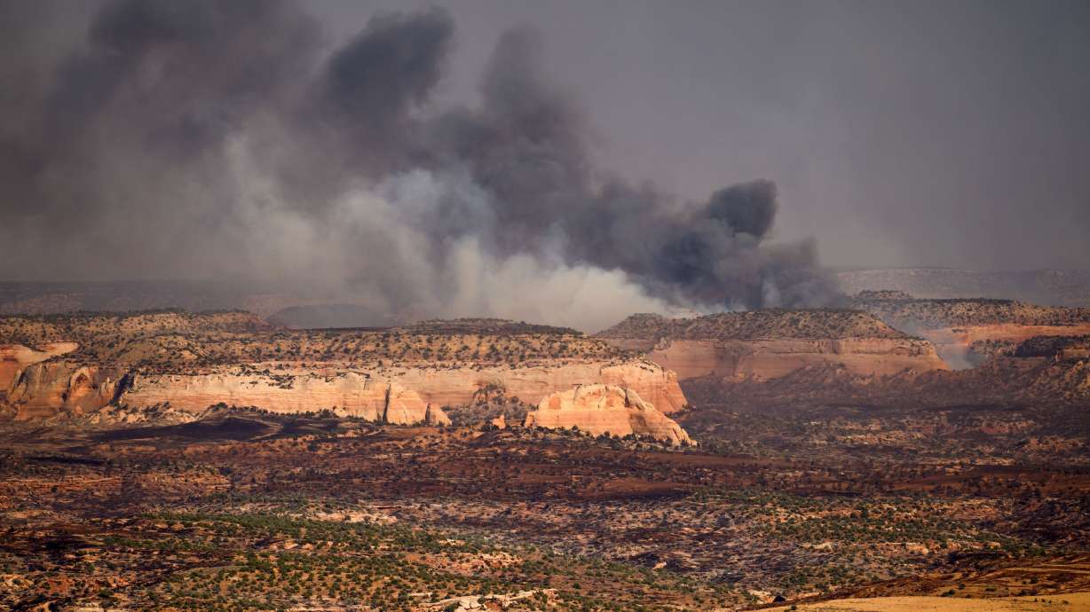 Smoke rises from the Snyder Fire near the Utah-Colorado border on June 28. Wildfires across both states are one of several impacts tied to increasing drought conditions in the West.