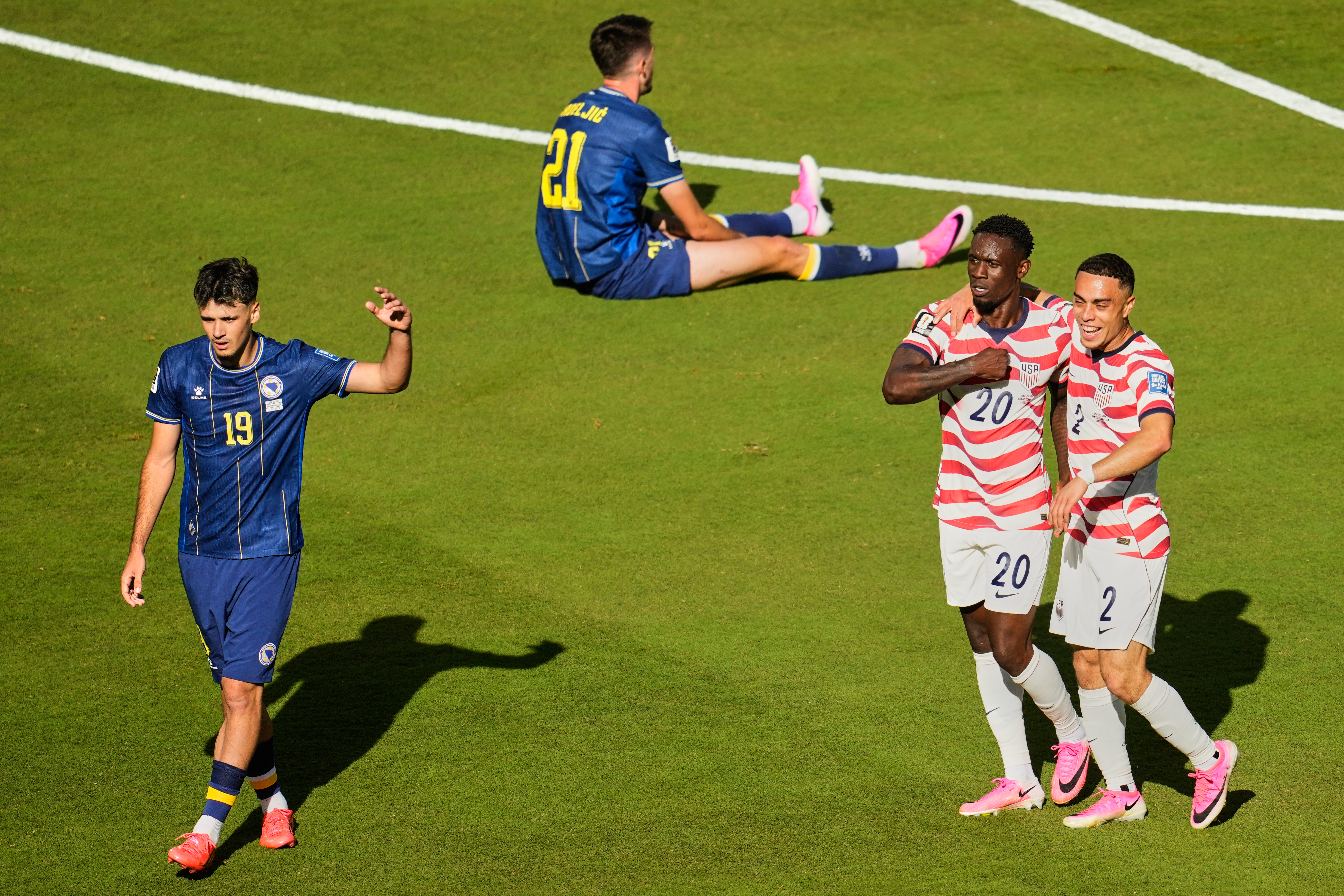 US beats Bosnia-Herzegovina 2-0 to advance to round of 16, keeping World Cup dreams alive