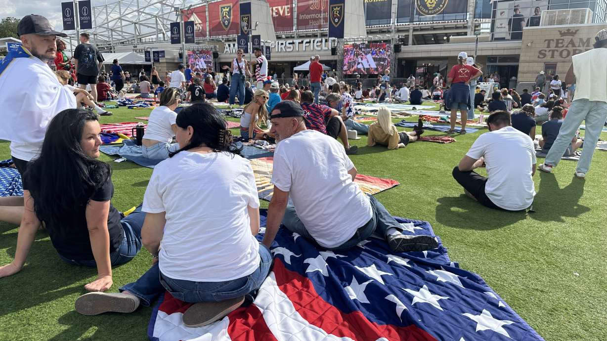 People attend a watch party for the World Cup match of the U.S. against Bosnia and Herzegovina in Sandy at America First Field on Wednesday. About 11,000 fans packed the plaza area.
