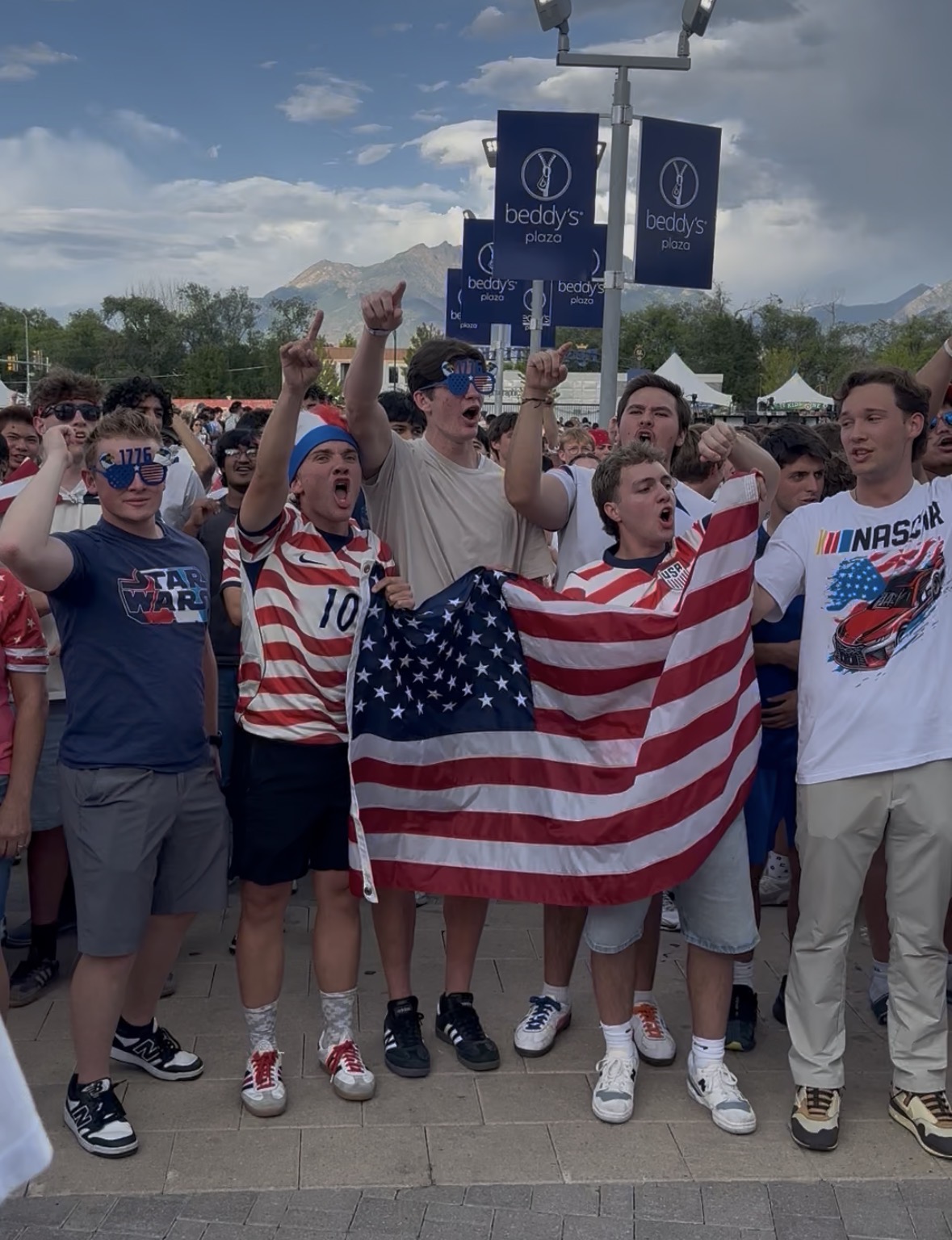 People attend a watch party for the World Cup match of the U.S. against Bosnia and Herzegovina in Sandy at America First Field on Wednesday. About 11,000 fans packed the plaza area.