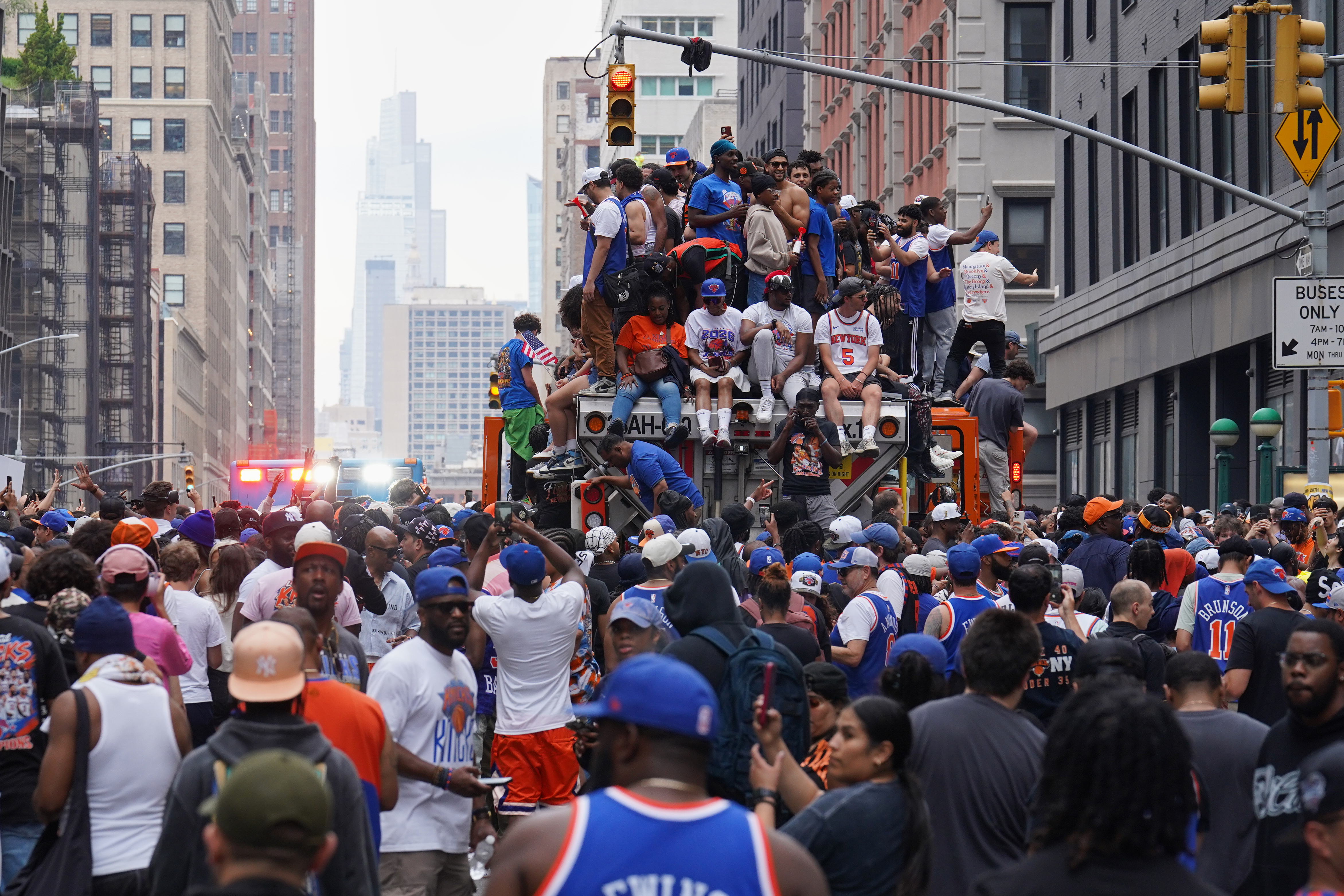 Fans celebrate during the New York Knicks' NBA championship parade Thursday, June 18, 2026, in New York. 