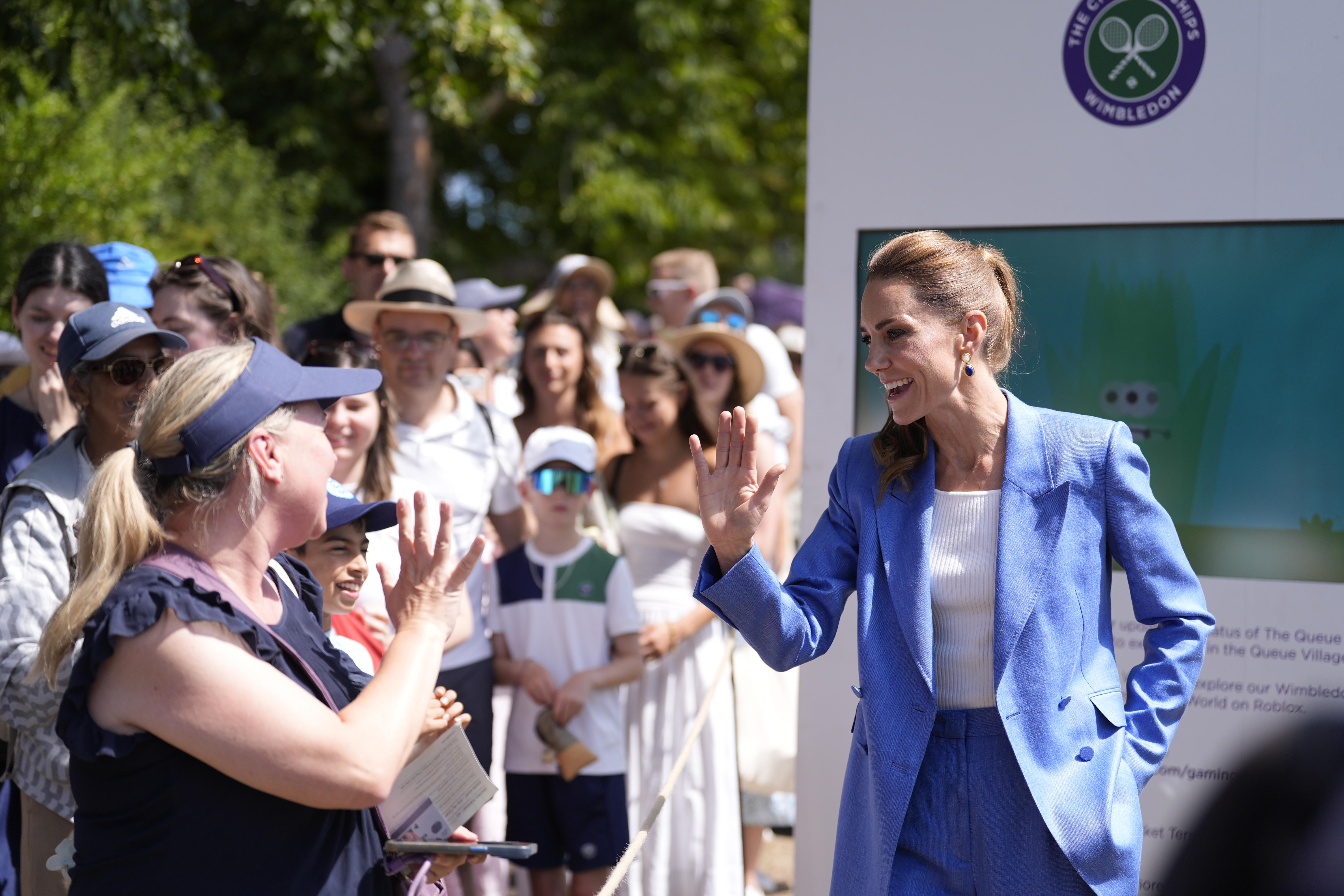 Britain's Kate, the Princess of Wales gestures during a visit on day four of the Wimbledon Tennis Championships in London, Thursday, July 2, 2026. 