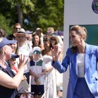 Princess Kate greets fans at Wimbledon and sits next to Andy Murray to watch the tennis