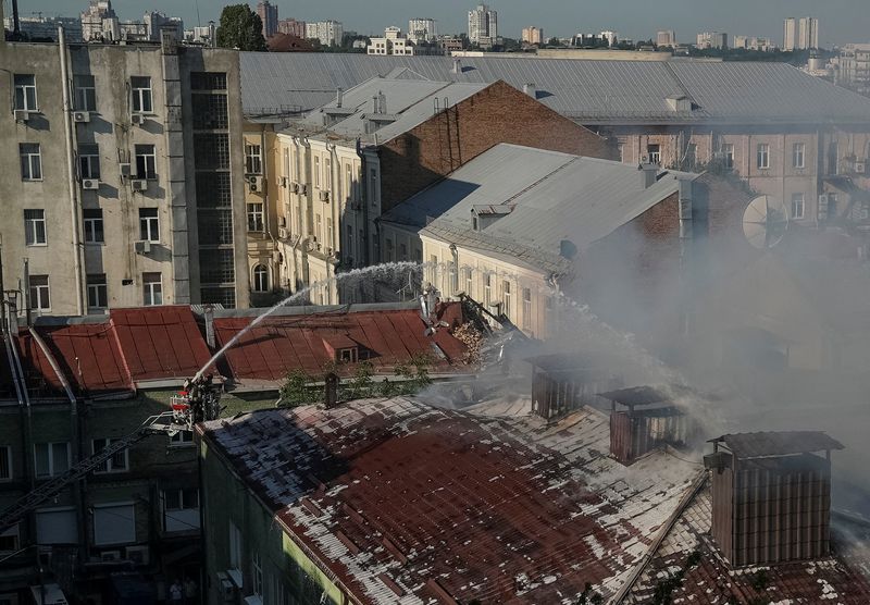 Firefighters work at the Palladin Institute of Biochemistry, hit by a Russian missile and drone strike, amid Russia's attack on Ukraine, in Kyiv, Thursday. The laboratory and other offices were gutted by the attack.