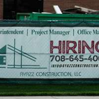 US filings for jobless aid fall to 215,000 as layoffs remain at historically healthy levels