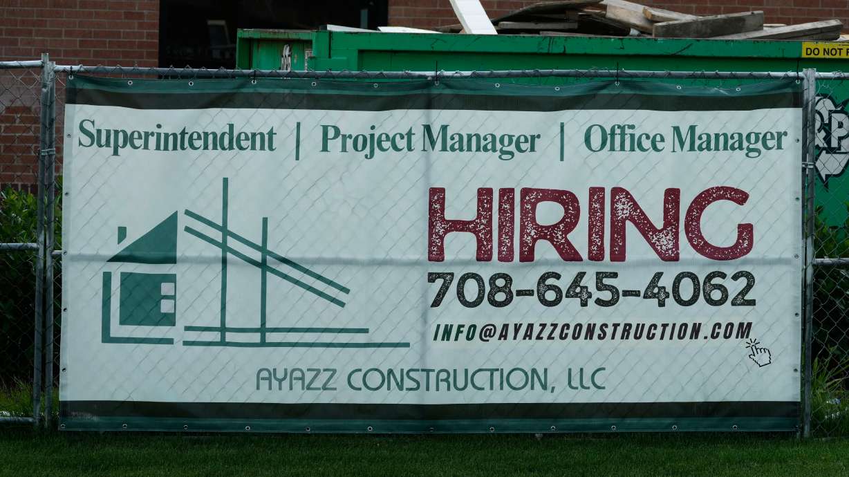 A hiring sign is seen in Buffalo Grove, Ill., Thursday, June 25, 2026.