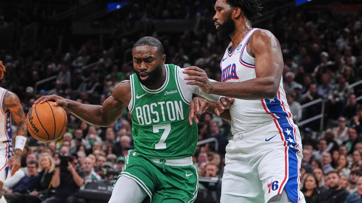 FILE - Boston Celtics forward Jaylen Brown (7) drives to the basket against Philadelphia 76ers center Joel Embiid, right, during the first half of an NBA basketball game, Wednesday, Oct. 22, 2025, in Boston.