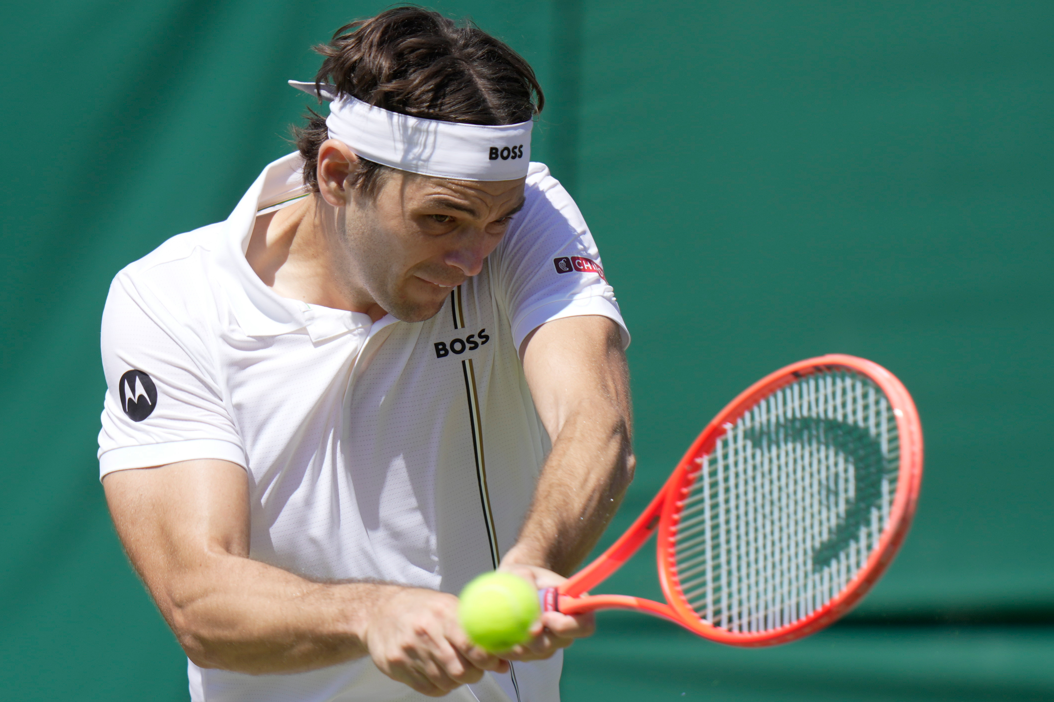 Taylor Fritz of the United States returns the ball to Patrick Kypson of the United States in their second round men's singles match at the Wimbledon Tennis Championships in London, Thursday, July 2, 2026. 