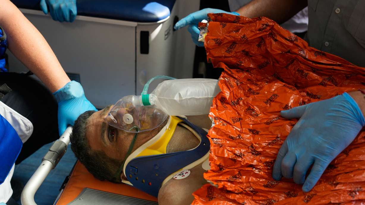 Rescue workers attend to Hernán Alberto Gil Flores after he was pulled from the rubble eight days after he was trapped by twin earthquakes that struck Catia La Mar, Venezuela, Thursday.