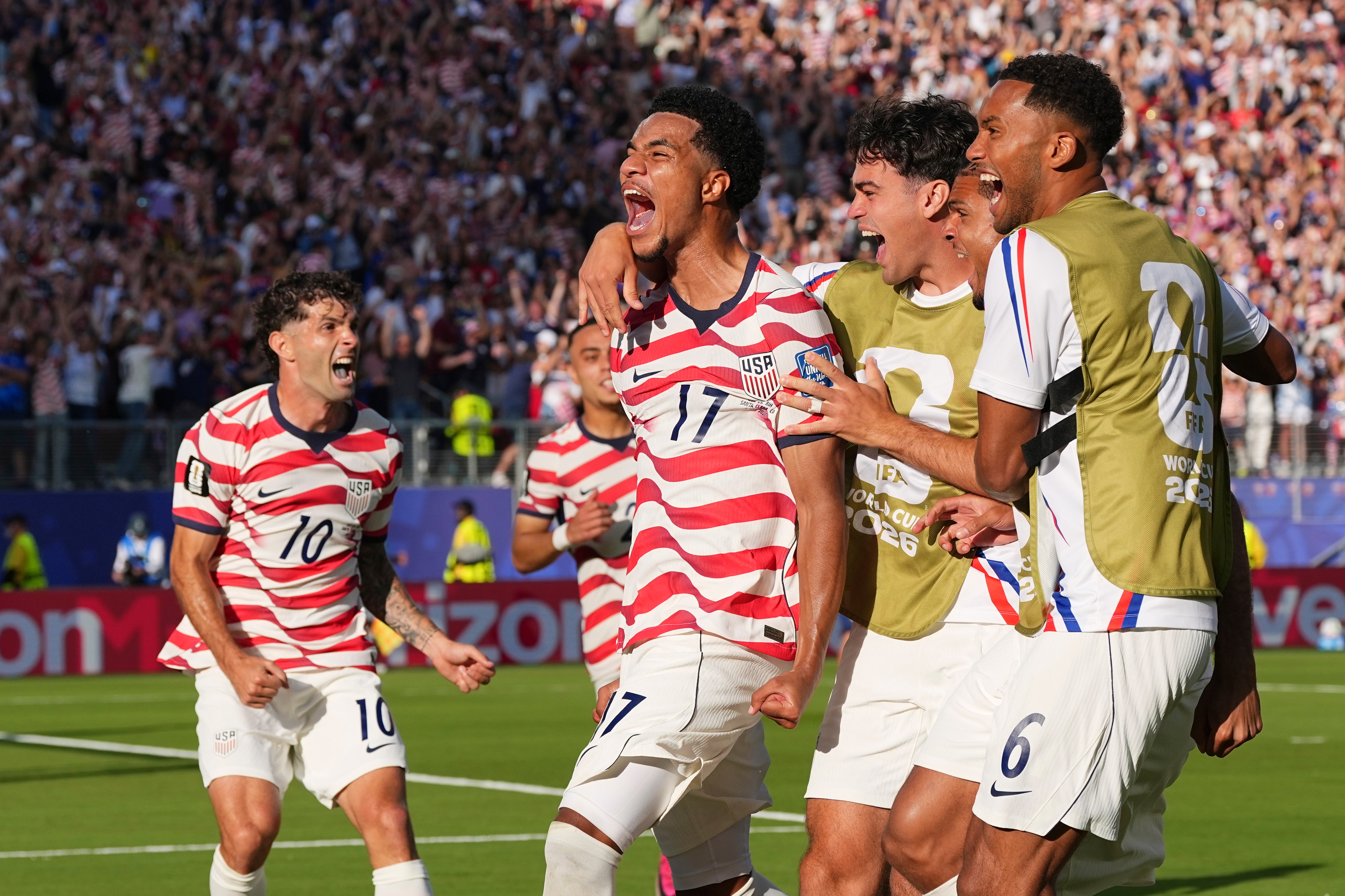 United States' Malik Tillman (17) celebrates with teammates after scoring on a free kick during the World Cup round of 32 soccer match between the United States and Bosnia in Santa Clara, Calif., near San Francisco, Wednesday, July 1, 2026. 
