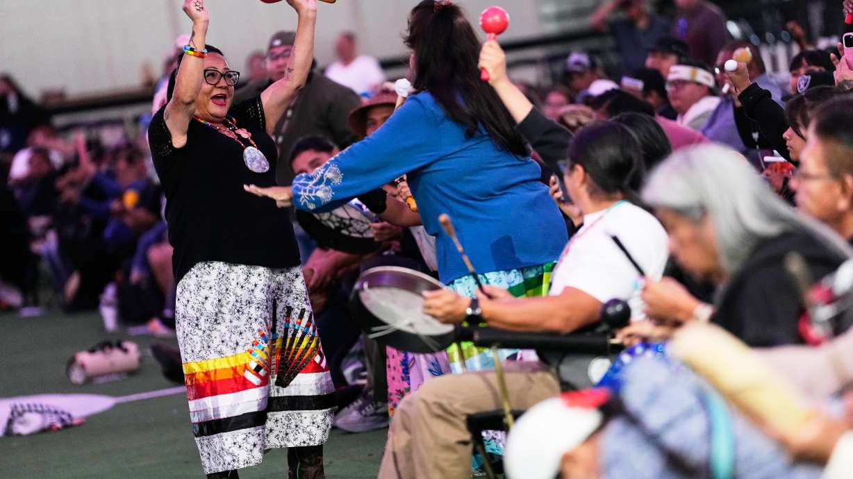 Christina Lomaintewa, facing, celebrates with Angie Lucero after their team won a "material game," a stick game played for objects, before a Stick-Games Tournament hosted by the Puyallup Tribe in partnership with World Cup host city Seattle, Saturday, June 27, 2026, in Tacoma, Wash.
