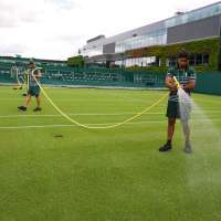 Wimbledon kept its courts lush green as other London lawns browned in record heat