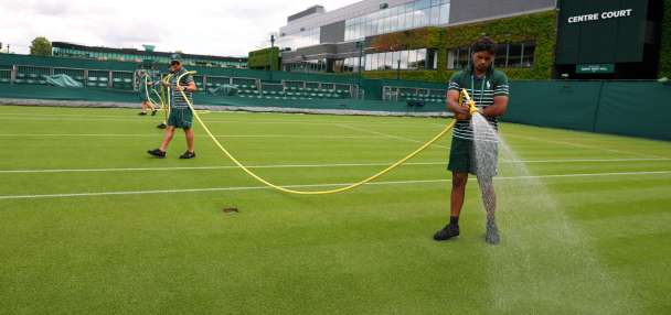 Wimbledon kept its courts lush green as other London lawns browned in record heat