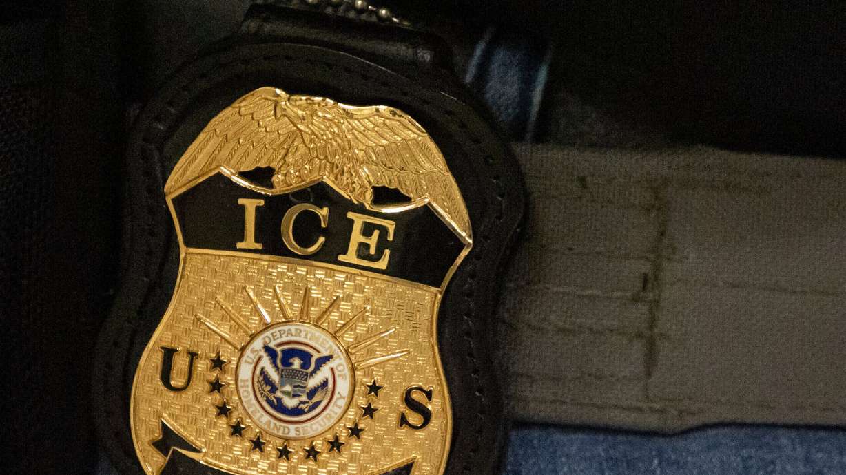 A federal agent wears an Immigration and Customs Enforcement badge in New York, June 10, 2025. ICE arrested 10,000 people over a five-day period at the end of June.