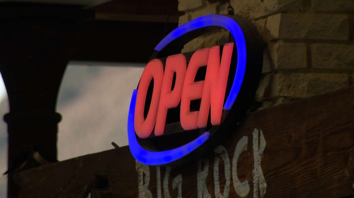 The Big Rock Candy Mountain Resort open sign is pictured in Marysvale, Piute County. The Cottonwood Fire continues to burn on Beaver Mountain, but about 20 miles away in Marysvale, business owners say another struggle is unfolding.