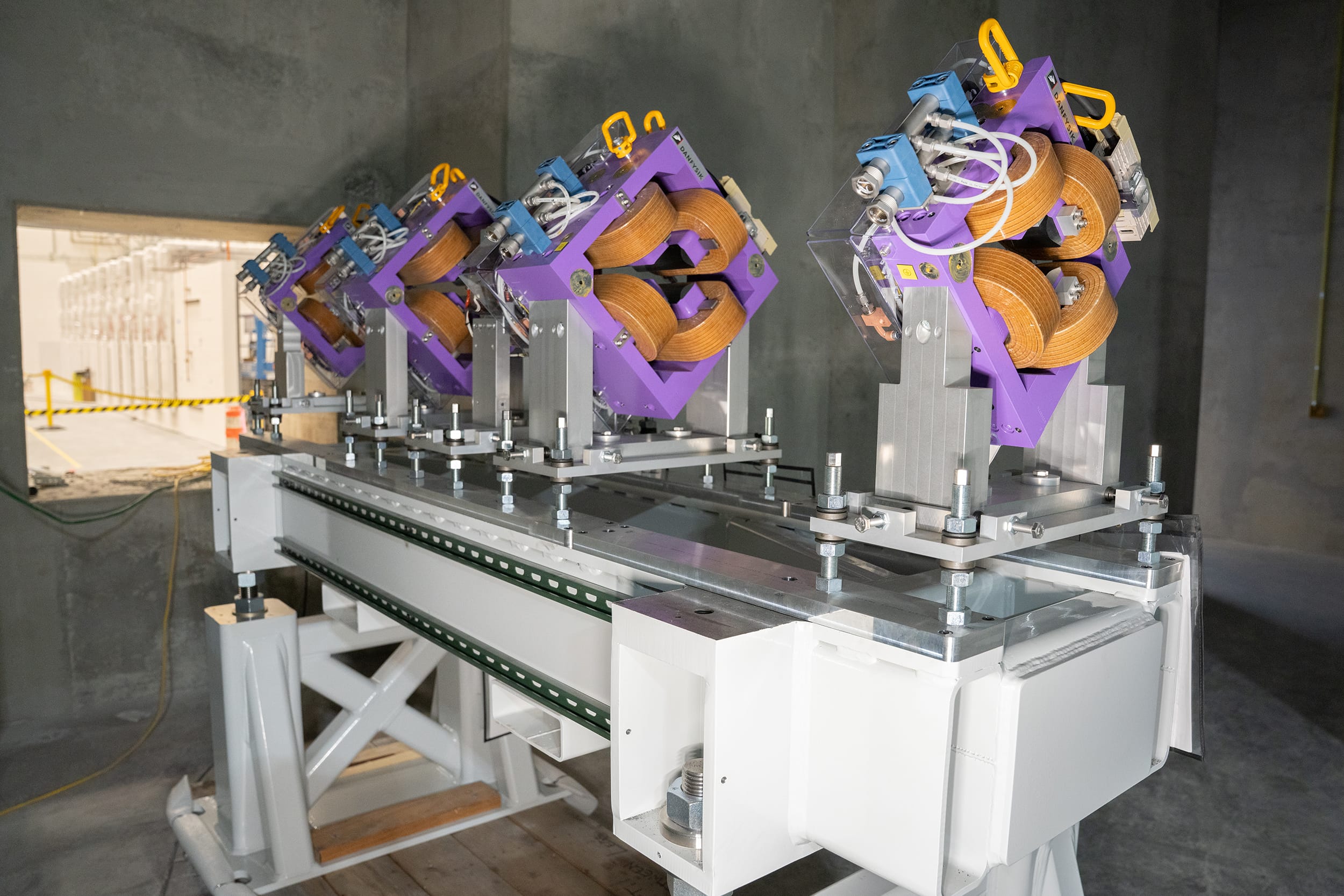 The high energy beam transport (HEBT) is the section of the accelerator that transports the beam from the exit of the drift tube linac (DTL) to the target bays. A careful arrangement of electromagnets – dipoles, quadrupoles, and octupoles – allow Nusano to steer, focus, and shape the beam. The beam travels through a vacuum pipe to one of four target bays, each housing three distinct target stations. This configuration allows Nusano to produce up to 12 isotopes simultaneously by sending beam pulses to the different target stations, each containing a different target.