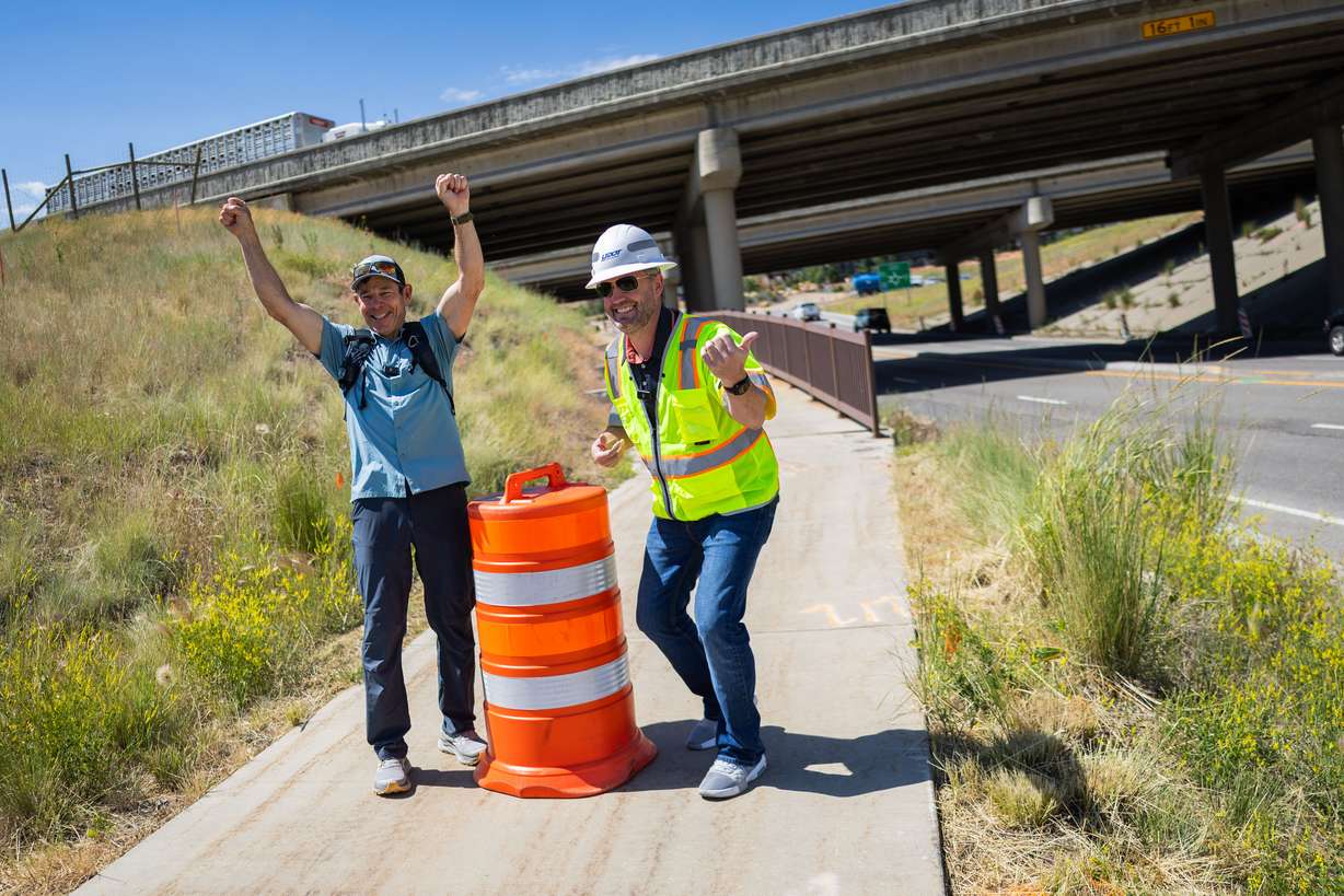 Sen. John Curtis, R-Utah, left, poses with Josh Sletten, UDOT deputy director of project development, right, while Curtis walks a 4-mile stretch from above Jeremy Ranch to Kimball Junction in Park City on Wednesday, as a part of his America 250 walk from Bear Lake to the Stadium of Fire. The walk follows a 250-mile continuous route over the course of nine days.